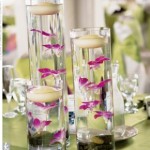 Dendrobium orchids topped with floating candles create a modern, airy feeling